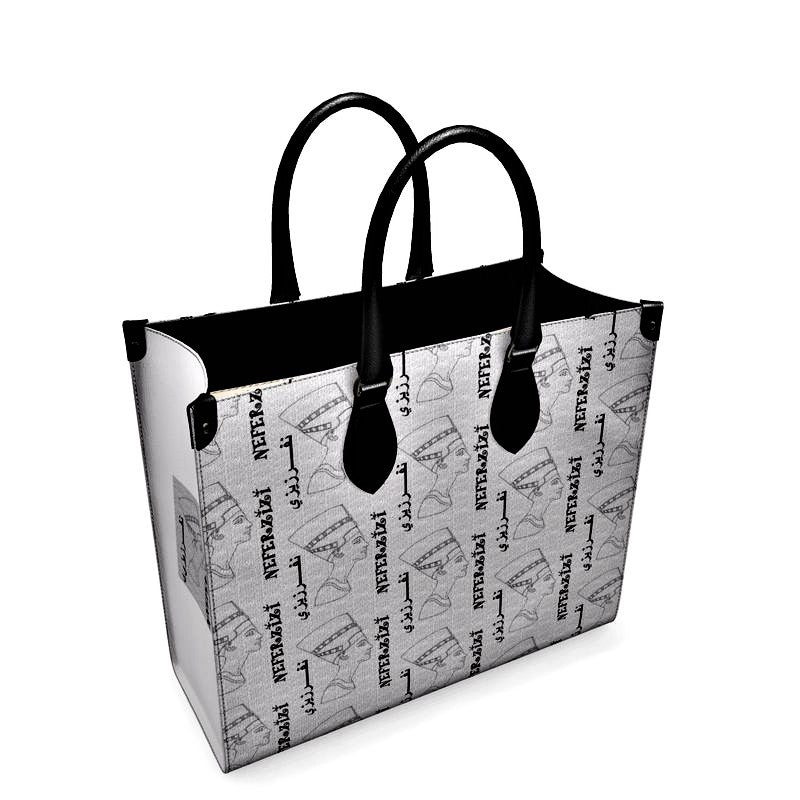 A black and white Tote bag with Nefertiti's Head all over.