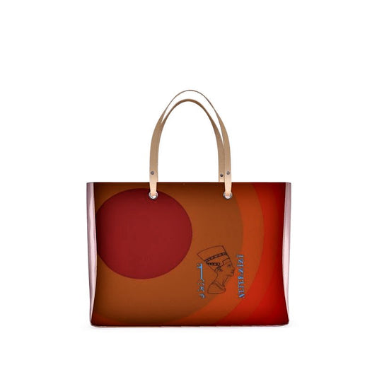 A handbag with pink handles and in the front is the image of Nefertiti's head and my logo is in an Arabic and English writing.