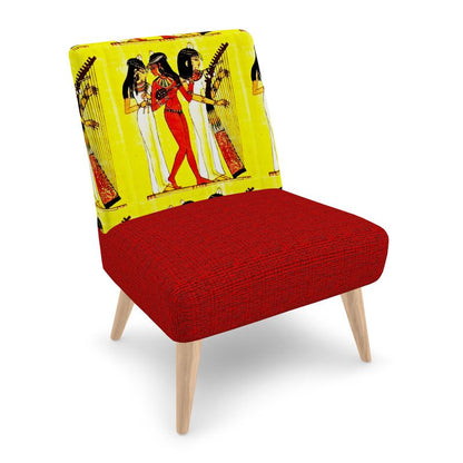 A chair in two colours, the back of the chair is in the image of three ancient Egyptian girls playing a harp and the seat of the chair is in red colour.